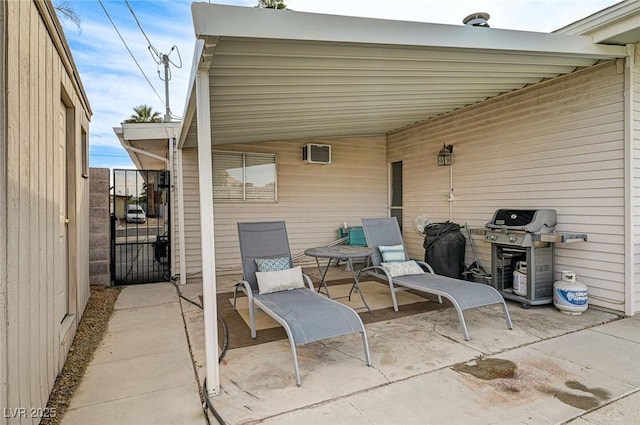 2496 Golfers St, Las Vegas, NV 89142 - view of patio / terrace with grilling area, a gate, and a wall mounted AC