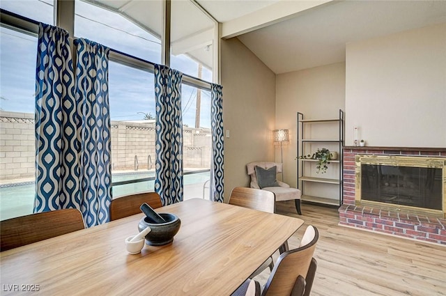 2496 Golfers St, Las Vegas, NV 89142 - dining area featuring a fireplace and wood finished floors