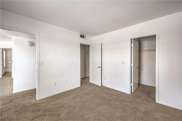 45 Maleena Mesa St Unit 1321, Henderson, NV 89074 - unfurnished bedroom with carpet flooring, a walk in closet, and a closet