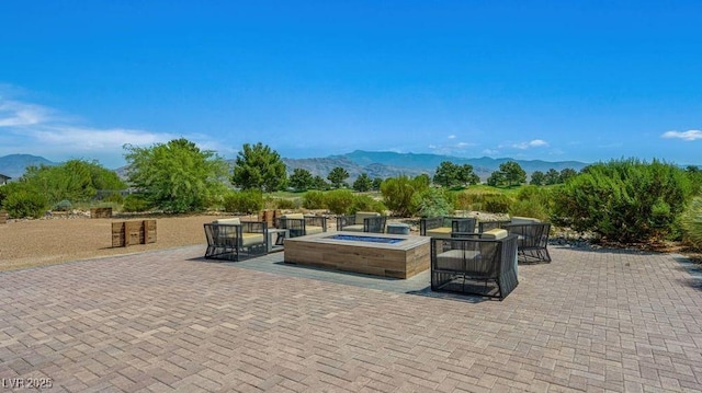 4130 E Brusca Way, Pahrump, NV 89061 - view of patio featuring a mountain view and an outdoor fire pit