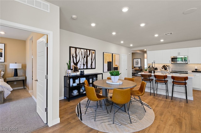4130 E Brusca Way, Pahrump, NV 89061 - dining room featuring light wood finished floors, recessed lighting, and baseboards