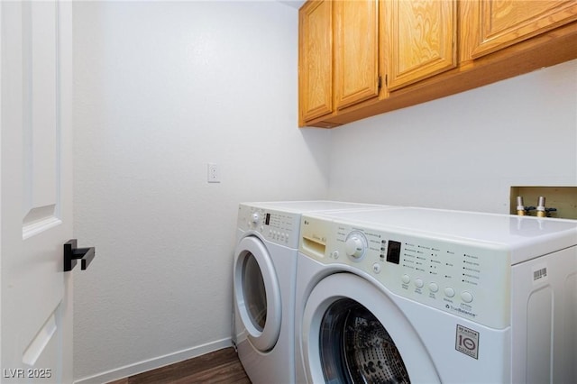 9817 Dardanelle Ct, Las Vegas, NV 89117 - laundry room with cabinet space, washing machine and dryer, baseboards, and dark wood-style flooring