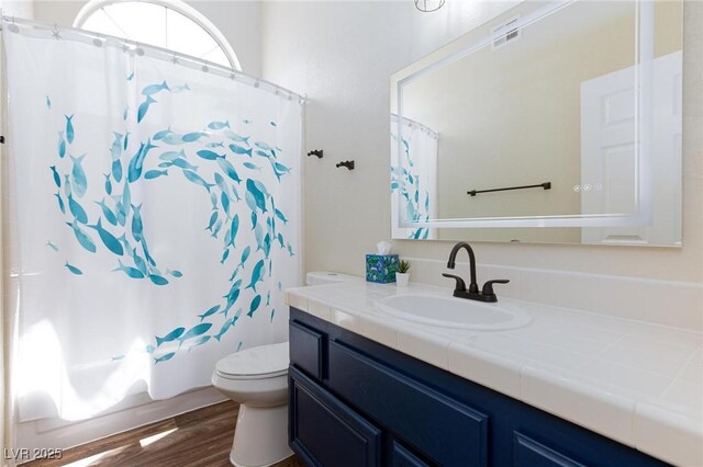 9817 Dardanelle Ct, Las Vegas, NV 89117 - full bathroom with toilet, vanity, wood finished floors, and a shower with curtain