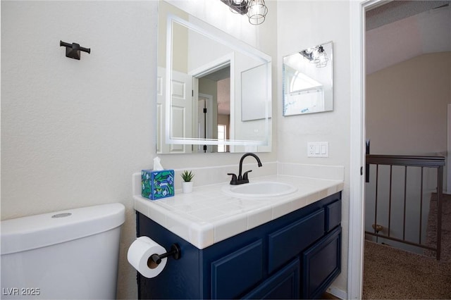 9817 Dardanelle Ct, Las Vegas, NV 89117 - half bath with toilet, vanity, and lofted ceiling