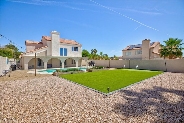 9817 Dardanelle Ct, Las Vegas, NV 89117 - back of property featuring stucco siding, a chimney, a tile roof, and a patio