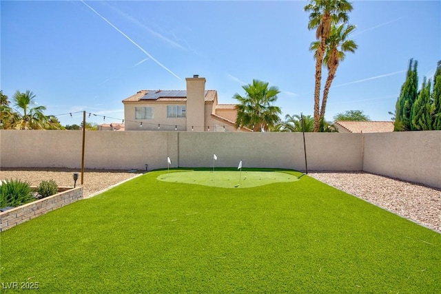 9817 Dardanelle Ct, Las Vegas, NV 89117 - fenced backyard featuring an area to practice putting