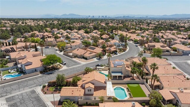 9817 Dardanelle Ct, Las Vegas, NV 89117 - aerial view of residential area with a pool area and mountains