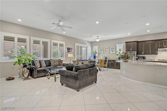 3155 Dalmazia Ave, Henderson, NV 89044 - living room with ceiling fan, recessed lighting, light tile patterned flooring, and baseboards