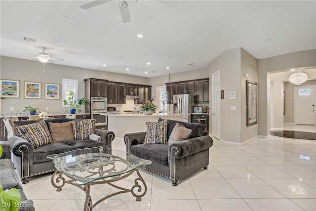 3155 Dalmazia Ave, Henderson, NV 89044 - living room featuring ceiling fan, light tile patterned floors, baseboards, and recessed lighting