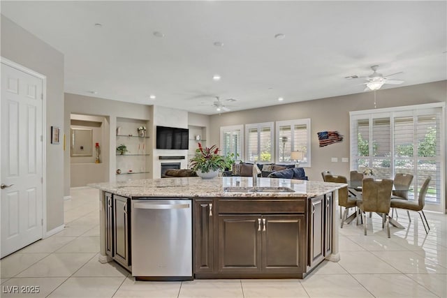 3155 Dalmazia Ave, Henderson, NV 89044 - kitchen featuring ceiling fan, stainless steel dishwasher, a sink, open floor plan, and dark brown cabinetry