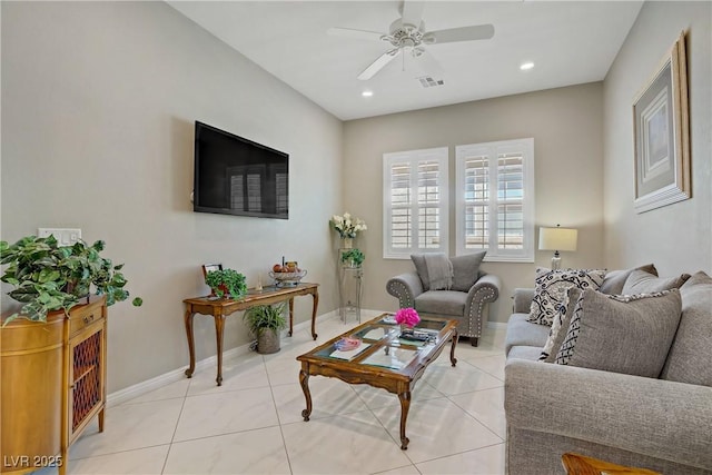 3155 Dalmazia Ave, Henderson, NV 89044 - living room with a ceiling fan, light tile patterned flooring, baseboards, and recessed lighting