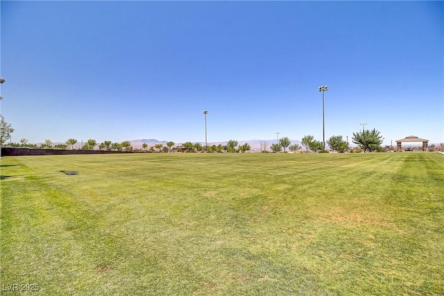 3155 Dalmazia Ave, Henderson, NV 89044 - view of grassy yard with a mountain view