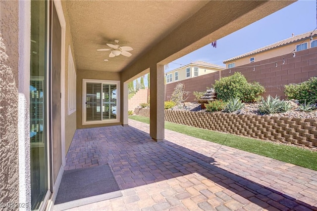 3155 Dalmazia Ave, Henderson, NV 89044 - fenced backyard with a ceiling fan and a patio area