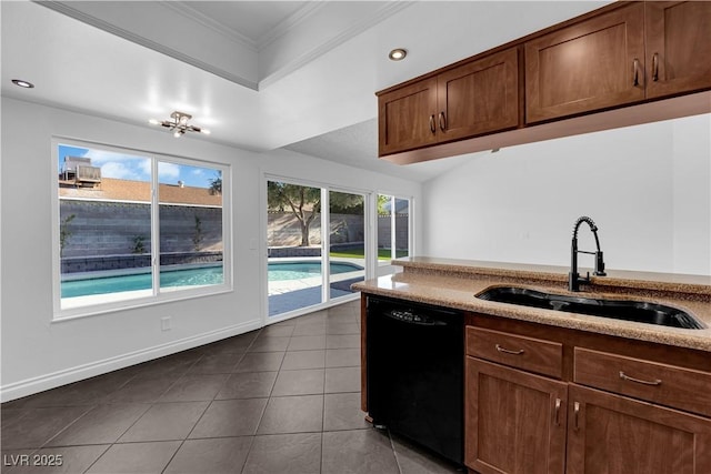 6791 Greengrove Dr, Las Vegas, NV 89103 - kitchen with black dishwasher, a sink, crown molding, dark tile patterned flooring, and light stone counters