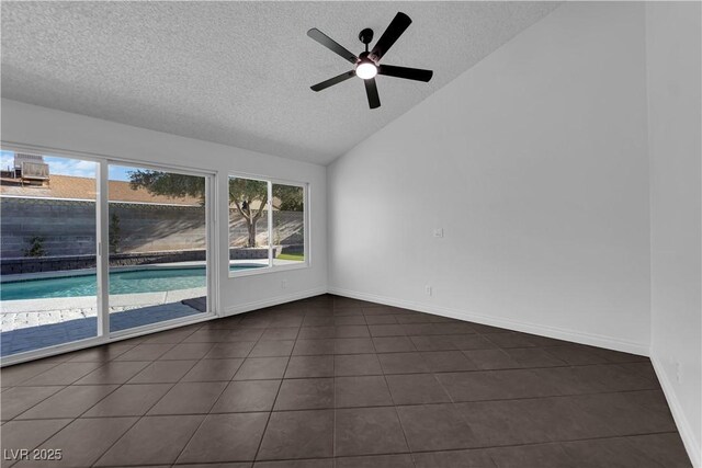 6791 Greengrove Dr, Las Vegas, NV 89103 - spare room featuring a textured ceiling, vaulted ceiling, dark tile patterned flooring, a ceiling fan, and baseboards