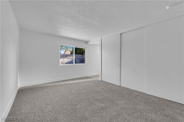 6791 Greengrove Dr, Las Vegas, NV 89103 - unfurnished bedroom with a textured ceiling, carpet floors, and a closet