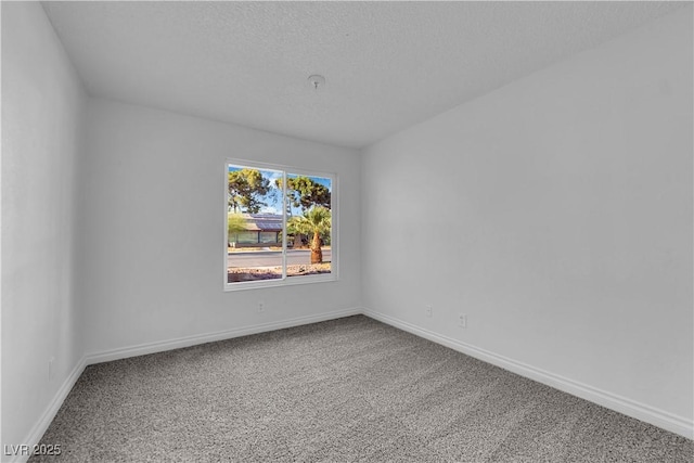 6791 Greengrove Dr, Las Vegas, NV 89103 - empty room with carpet, baseboards, and a textured ceiling
