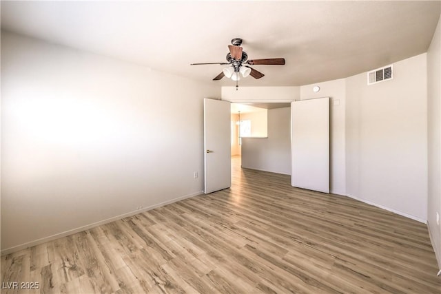 5710 E Tropicana Ave Unit 1114, Las Vegas, NV 89122 - unfurnished room with a ceiling fan, light wood-type flooring, and baseboards