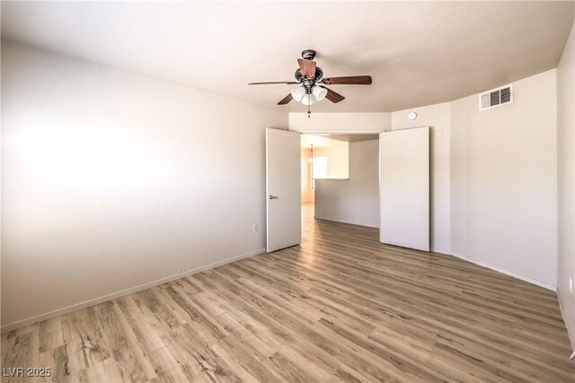 5710 E Tropicana Ave Unit 1114, Las Vegas, NV 89122 - unfurnished room with a ceiling fan, light wood-type flooring, and baseboards