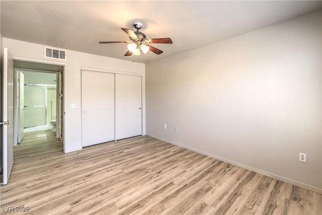 5710 E Tropicana Ave Unit 1114, Las Vegas, NV 89122 - unfurnished bedroom with light wood-style floors, a closet, baseboards, and ceiling fan