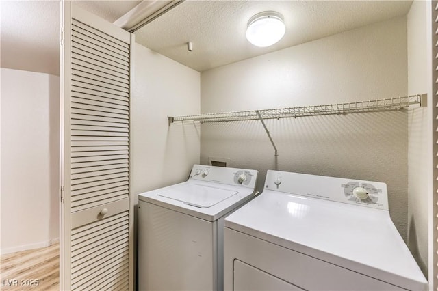 5710 E Tropicana Ave Unit 1114, Las Vegas, NV 89122 - laundry area featuring separate washer and dryer and light wood-style flooring
