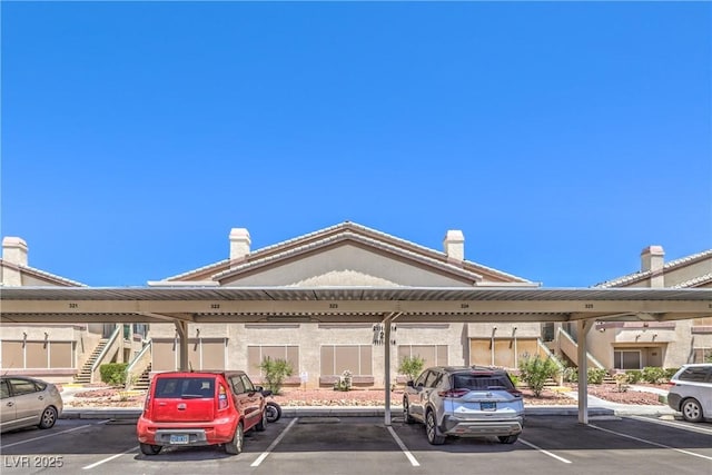 5710 E Tropicana Ave Unit 1114, Las Vegas, NV 89122 - covered parking lot featuring stairs