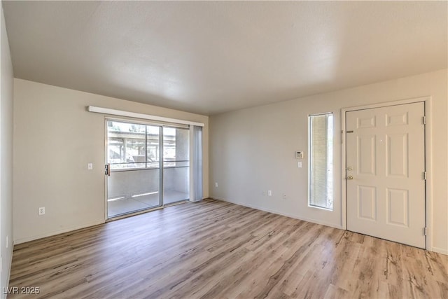 5710 E Tropicana Ave Unit 1114, Las Vegas, NV 89122 - foyer with light wood-style flooring and baseboards