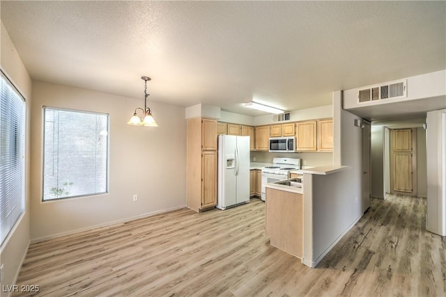 5710 E Tropicana Ave Unit 1114, Las Vegas, NV 89122 - kitchen with white appliances, light brown cabinetry, light wood-type flooring, light countertops, and baseboards