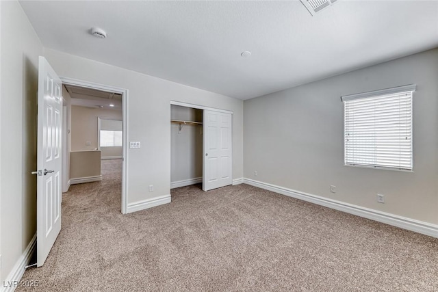 9766 Marcelline Ave, Las Vegas, NV 89148 - unfurnished bedroom with attic access, carpet flooring, multiple windows, and baseboards