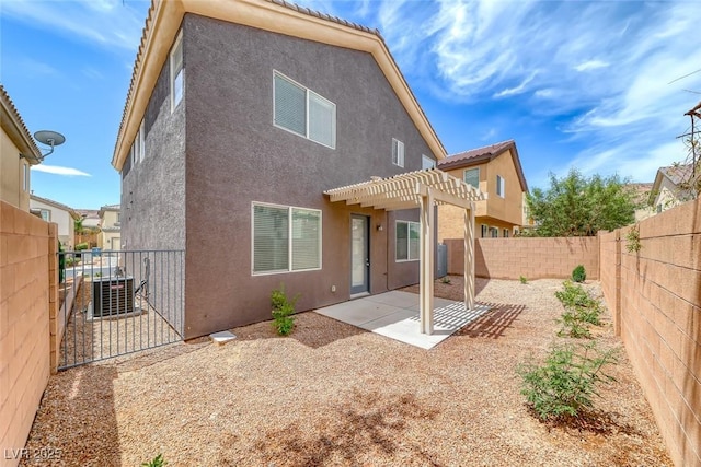 9766 Marcelline Ave, Las Vegas, NV 89148 - rear view of property featuring stucco siding, a pergola, a fenced backyard, a patio area, and a gate