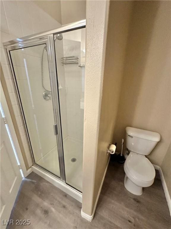 10455 Alpine Edge Ave, Las Vegas, NV 89129 - full bath featuring wood finished floors, a shower stall, toilet, and baseboards