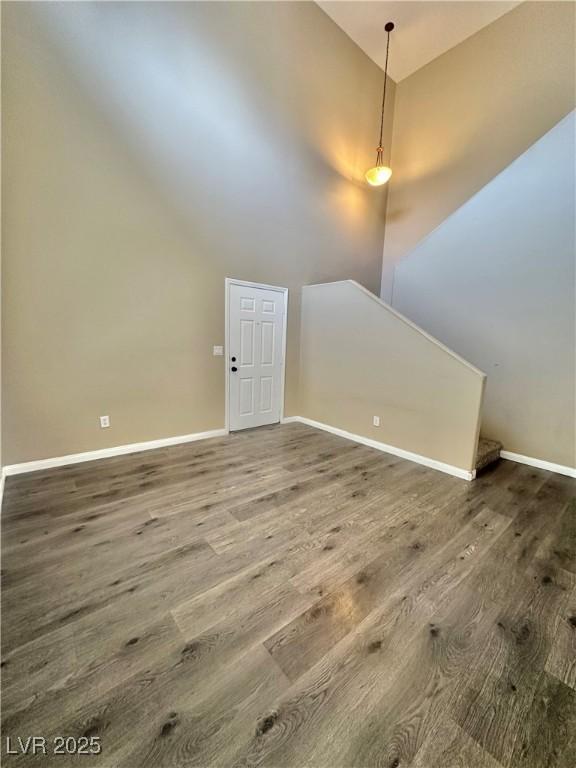 10455 Alpine Edge Ave, Las Vegas, NV 89129 - bonus room featuring wood finished floors, baseboards, and high vaulted ceiling