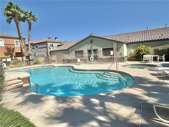 10455 Alpine Edge Ave, Las Vegas, NV 89129 - community pool featuring a hot tub and a patio area