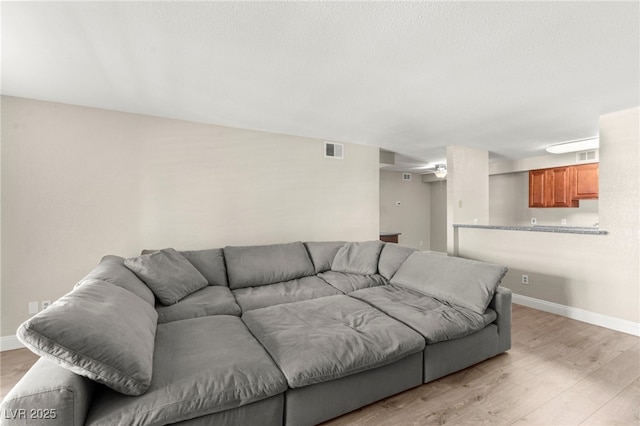 2606 S Durango Dr Unit 245, Las Vegas, NV 89117 - living area with light wood-type flooring and baseboards