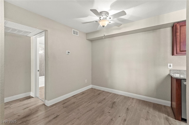 2606 S Durango Dr Unit 245, Las Vegas, NV 89117 - empty room with light wood-type flooring, a ceiling fan, and baseboards