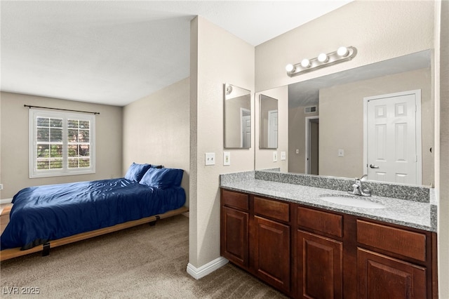 2606 S Durango Dr Unit 245, Las Vegas, NV 89117 - ensuite bathroom with vanity and baseboards