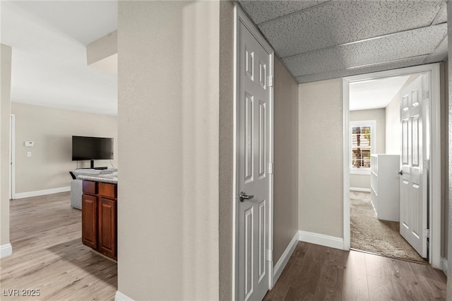 2606 S Durango Dr Unit 245, Las Vegas, NV 89117 - corridor featuring light wood-type flooring and baseboards