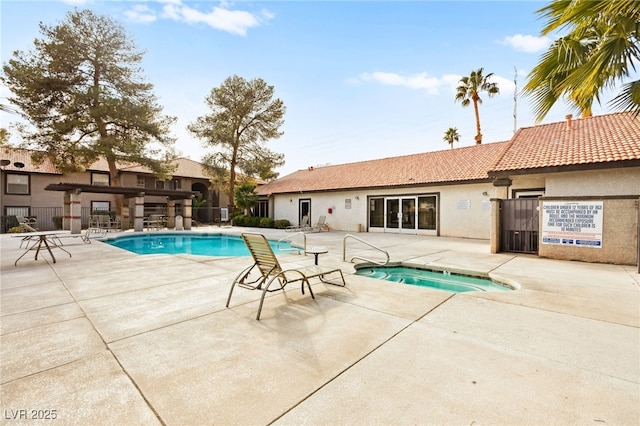 2606 S Durango Dr Unit 245, Las Vegas, NV 89117 - community pool with a community hot tub and a patio