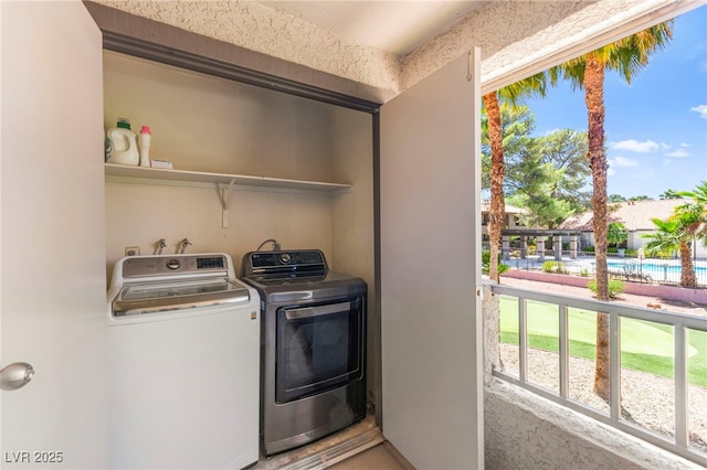 2606 S Durango Dr Unit 245, Las Vegas, NV 89117 - laundry room featuring washing machine and dryer and healthy amount of natural light