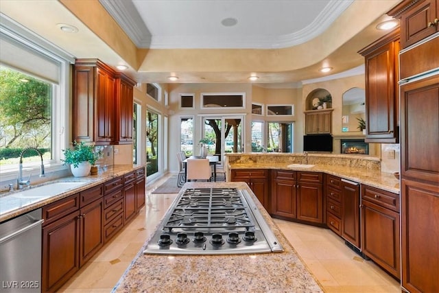 1 Via Mira Monte, Henderson, NV 89011 - kitchen with appliances with stainless steel finishes, a sink, ornamental molding, light stone counters, and recessed lighting