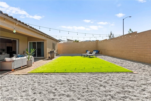 10906 Mila Landing Ave, Las Vegas, NV 89166 - fenced backyard with an outdoor living space and a patio