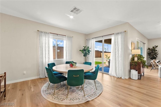 10906 Mila Landing Ave, Las Vegas, NV 89166 - dining room featuring plenty of natural light, light wood-style flooring, and baseboards