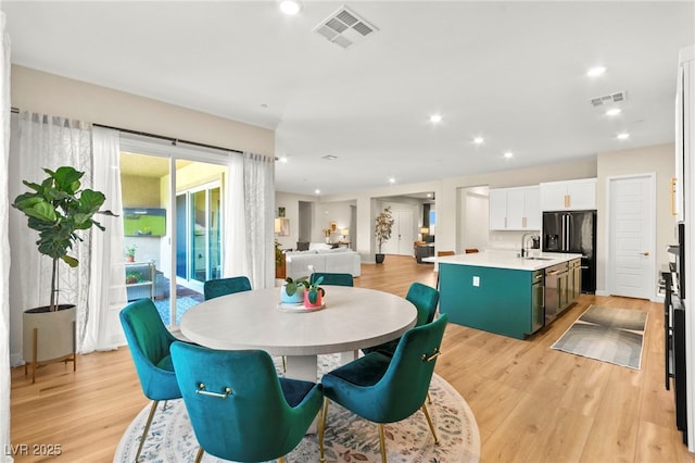 10906 Mila Landing Ave, Las Vegas, NV 89166 - dining area featuring light wood-style floors and recessed lighting