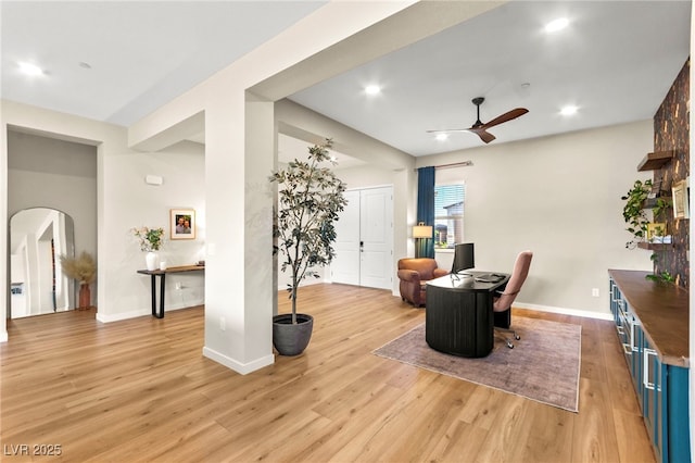 10906 Mila Landing Ave, Las Vegas, NV 89166 - dining space with ceiling fan, arched walkways, light wood-style floors, baseboards, and recessed lighting