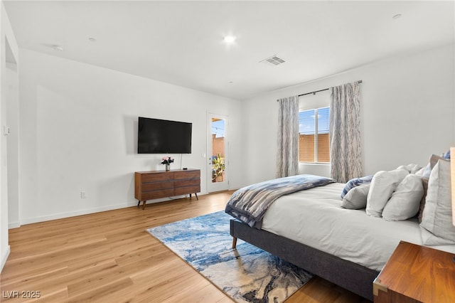 10906 Mila Landing Ave, Las Vegas, NV 89166 - bedroom featuring light wood-style flooring, baseboards, and access to exterior