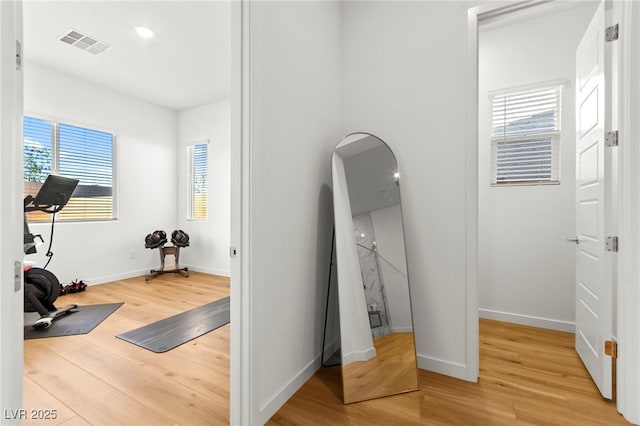 10906 Mila Landing Ave, Las Vegas, NV 89166 - exercise room with light wood finished floors and baseboards