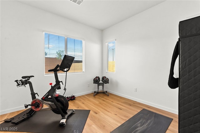 10906 Mila Landing Ave, Las Vegas, NV 89166 - workout area featuring light wood-type flooring and baseboards
