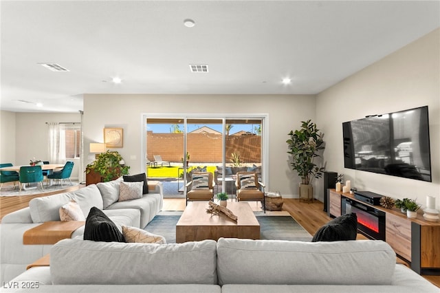 10906 Mila Landing Ave, Las Vegas, NV 89166 - living room with wood finished floors and recessed lighting