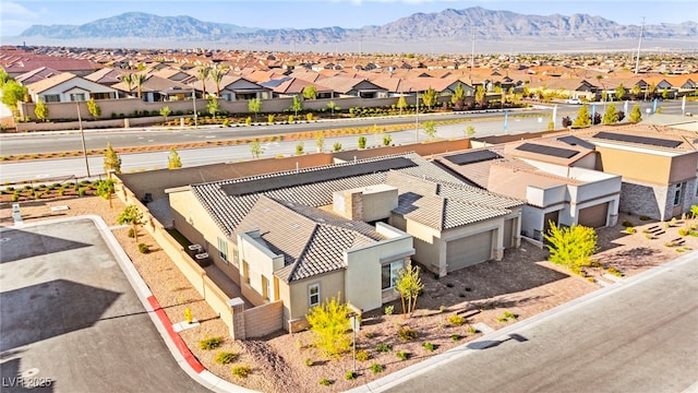 10906 Mila Landing Ave, Las Vegas, NV 89166 - aerial perspective of suburban area with a mountain backdrop