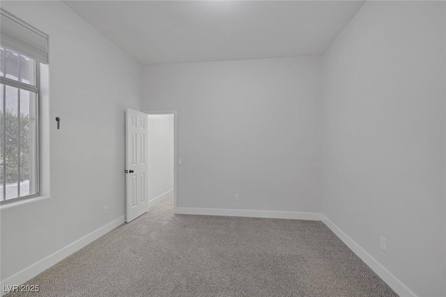 10113 Plomosa Pl, Las Vegas, NV 89134 - spare room featuring carpet and baseboards